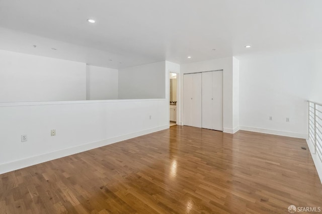 unfurnished room featuring hardwood / wood-style flooring