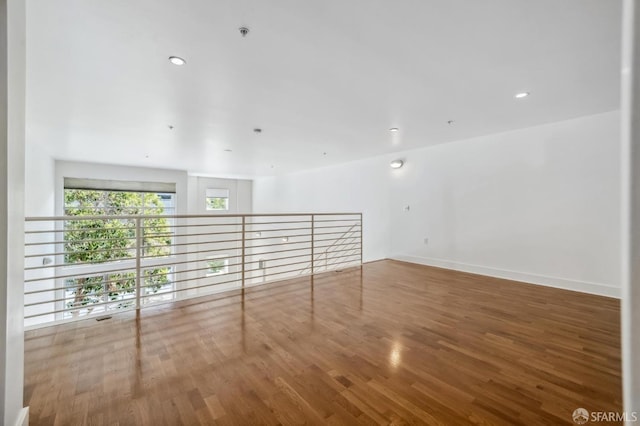 spare room with wood-type flooring