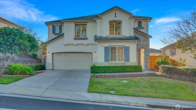 view of front of home with a garage and a front yard