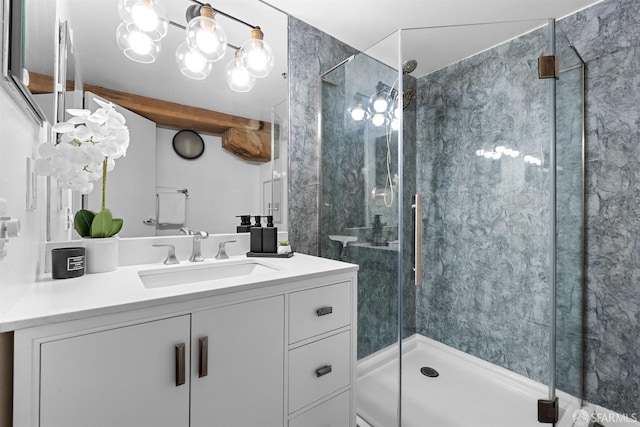 bathroom featuring a stall shower and vanity