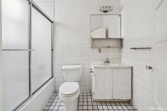 1385-1387 Vallejo St, San Francisco, CA 94109 - full bathroom with tile walls, vanity, toilet, combined bath / shower with glass door, and tile patterned floors
