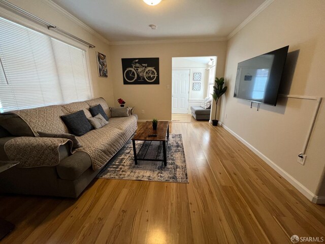 558 A St, Hayward, CA 94541 - living area with a healthy amount of sunlight, baseboards, wood-type flooring, and ornamental molding