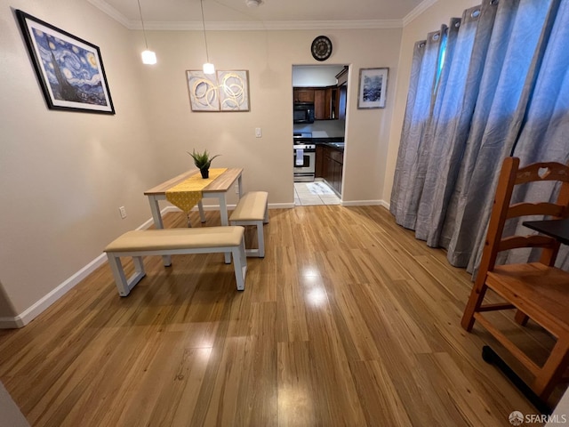 558 A St, Hayward, CA 94541 - dining room featuring light wood-style flooring, crown molding, and baseboards
