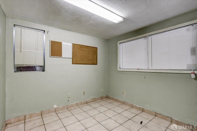 558 A St, Hayward, CA 94541 - spare room featuring a textured ceiling and light tile patterned flooring