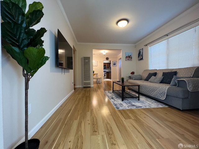 558 A St, Hayward, CA 94541 - living room featuring baseboards, crown molding, and light wood finished floors