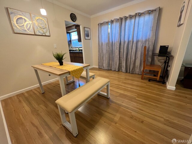 558 A St, Hayward, CA 94541 - dining area featuring ornamental molding, baseboards, and wood finished floors