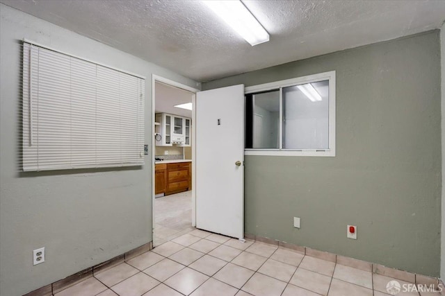 558 A St, Hayward, CA 94541 - spare room with light tile patterned floors and a textured ceiling