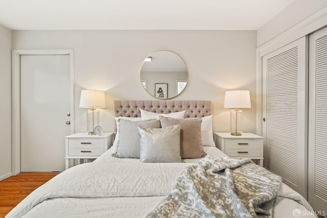 bedroom featuring a closet and wood finished floors