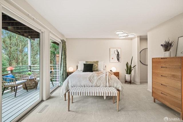 bedroom with visible vents, baseboards, light colored carpet, and access to outside