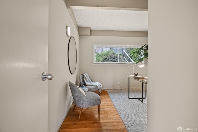 living area featuring wood finished floors and baseboards