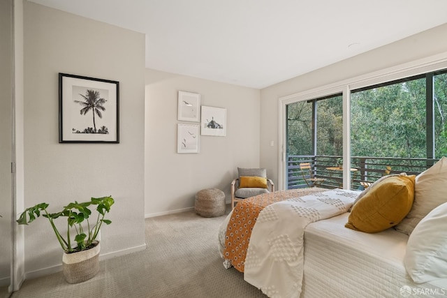 carpeted bedroom featuring baseboards