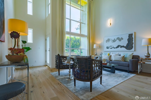 3118 18th St Unit 2, San Francisco, CA 94110 - living area with a towering ceiling, wood finished floors, and healthy amount of natural light