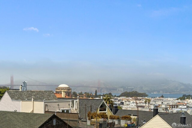 view of city featuring a nearby body of water and a notable bridge