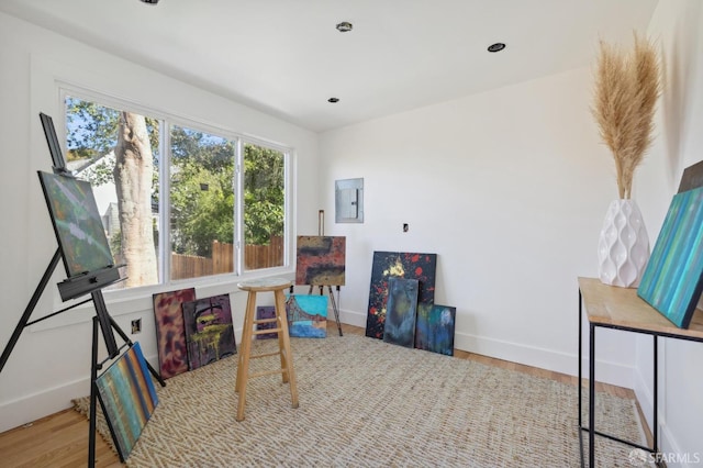 interior space with light hardwood / wood-style floors and electric panel