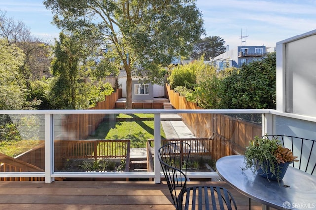 wooden balcony featuring a deck