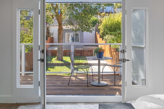 doorway to outside with wood-type flooring and french doors