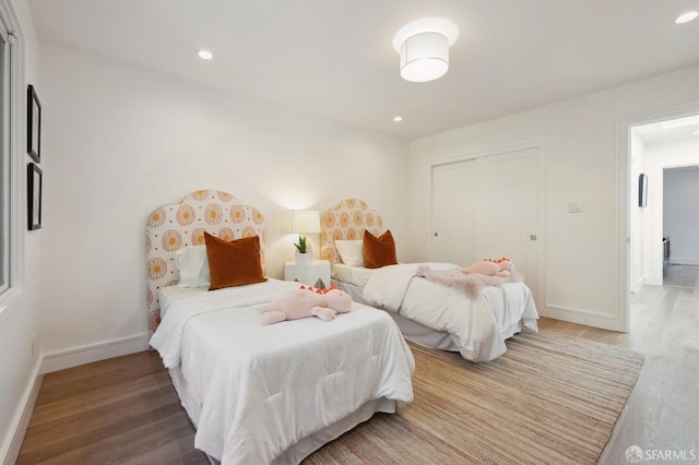 bedroom featuring a closet and hardwood / wood-style floors