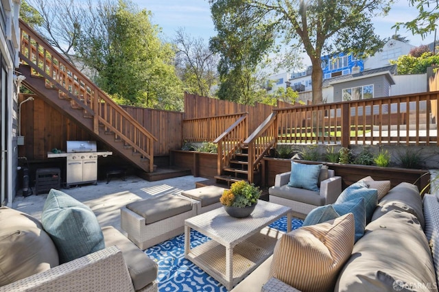 view of patio / terrace featuring an outdoor hangout area, a wooden deck, and a grill