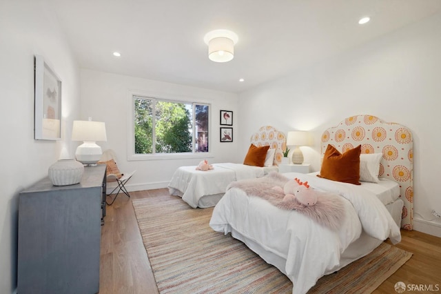 bedroom featuring light hardwood / wood-style floors