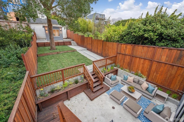 deck with an outdoor hangout area, a patio area, and a yard