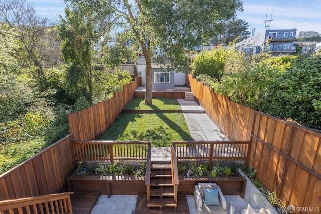 view of yard featuring a patio area and a deck