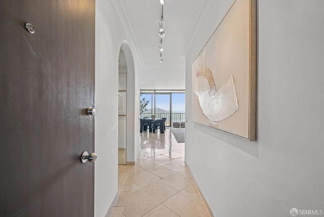 999 Green St Unit 1403, San Francisco, CA 94133 - hallway with arched walkways, expansive windows, rail lighting, and light tile patterned flooring
