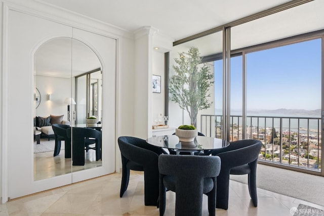 999 Green St Unit 1403, San Francisco, CA 94133 - dining space with crown molding, plenty of natural light, arched walkways, and a water view