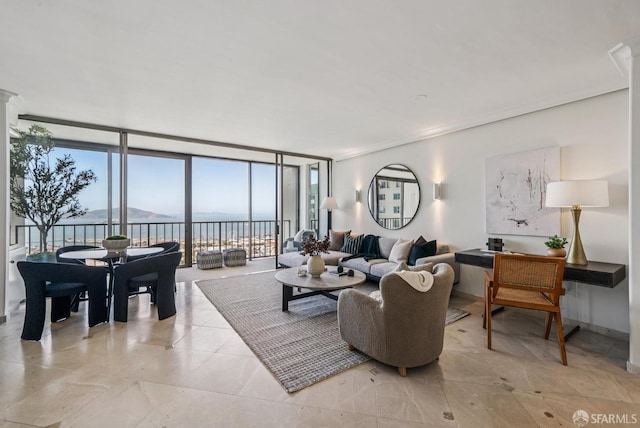 999 Green St Unit 1403, San Francisco, CA 94133 - living room featuring floor to ceiling windows, a water view, plenty of natural light, crown molding, and decorative columns