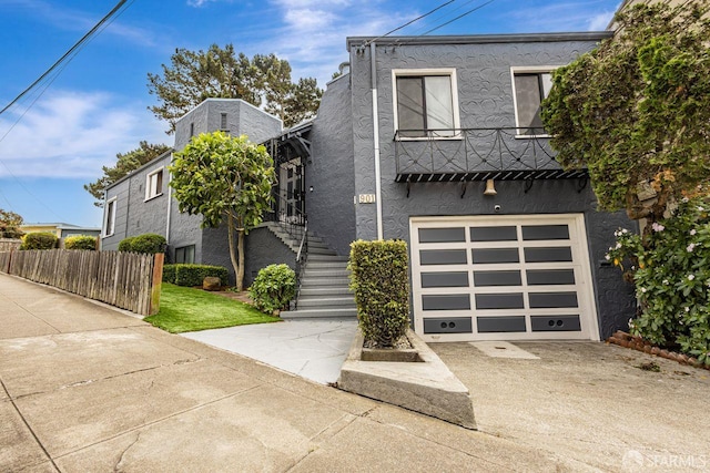 901 Teresita Blvd, San Francisco, CA 94127 - view of front facade with stucco siding, concrete driveway, a garage, and stairway