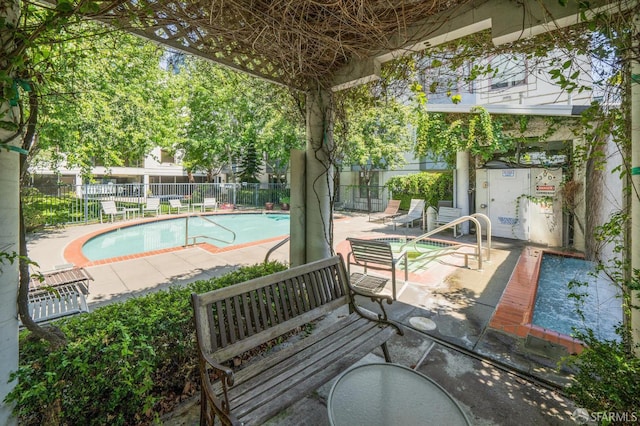 201 Harrison St Unit 302, San Francisco, CA 94105 - community pool featuring a patio area and fence