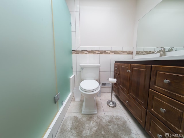 full bath featuring visible vents, toilet, a stall shower, vanity, and tile patterned flooring