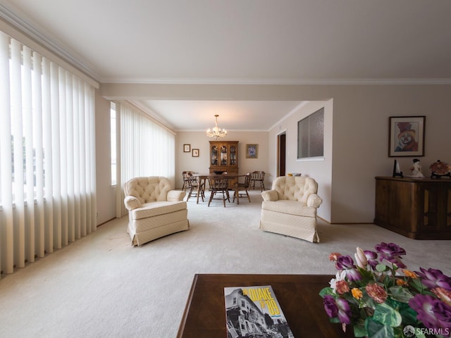 carpeted living area with crown molding and a notable chandelier