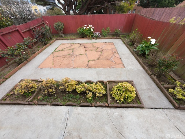 exterior space with a patio and a fenced backyard