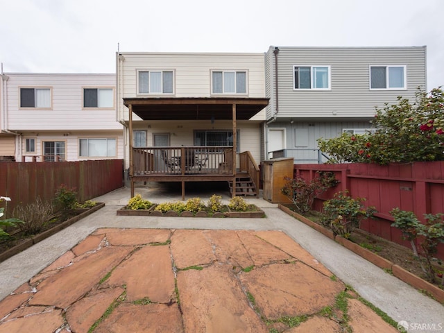 back of house featuring a fenced backyard