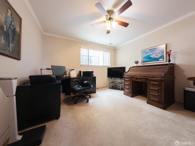 carpeted home office with a ceiling fan and crown molding