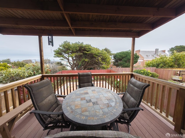 deck with outdoor dining area and fence private yard