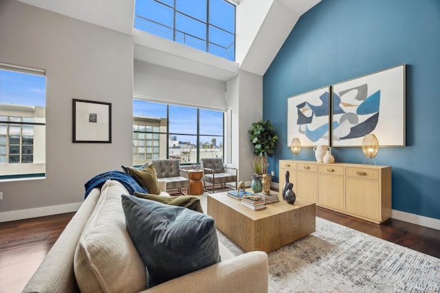 living room with dark hardwood / wood-style floors and high vaulted ceiling