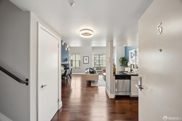 hall with sink and dark wood-type flooring