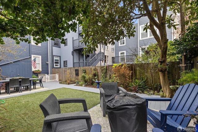 view of patio with fence and area for grilling