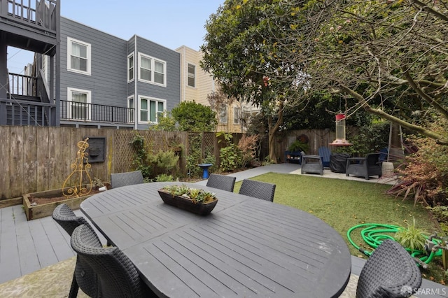 view of patio / terrace with outdoor dining space and a fenced backyard