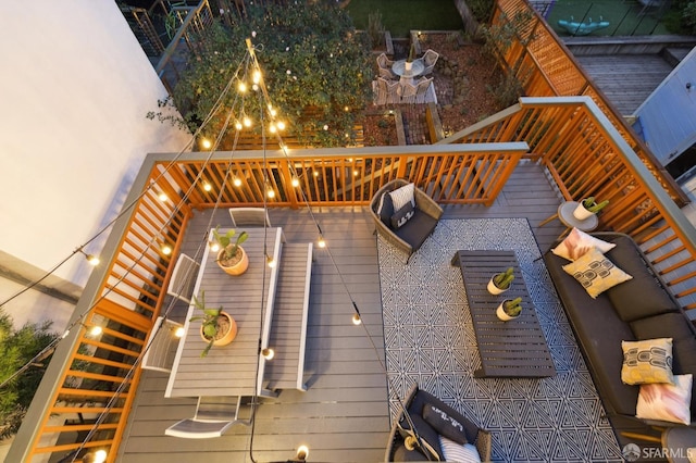 wooden deck with an outdoor living space