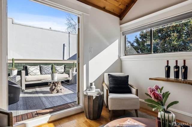 sitting room featuring hardwood / wood-style flooring, lofted ceiling, and wooden ceiling