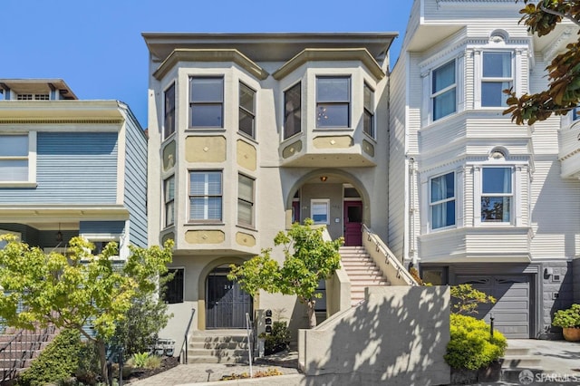multi unit property featuring a garage