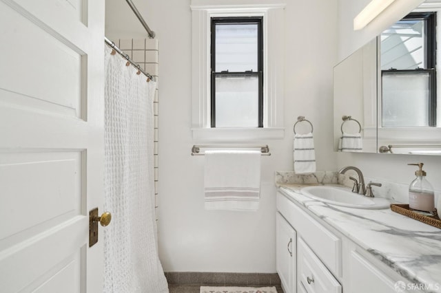 bathroom with vanity and a shower with curtain