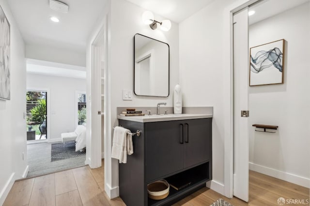 835 Diamond St, San Francisco, CA 94114 - bathroom with vanity, wood finished floors, baseboards, and recessed lighting