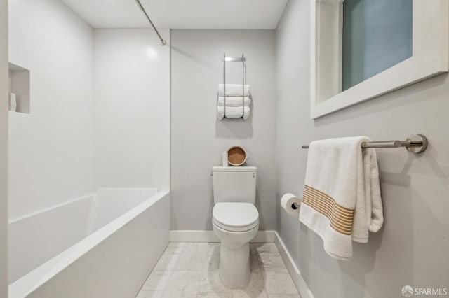 835 Diamond St, San Francisco, CA 94114 - bathroom featuring marble finish flooring, toilet, washtub / shower combination, and baseboards