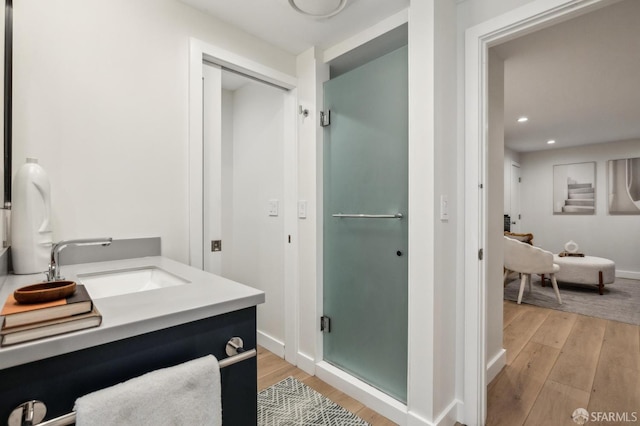 835 Diamond St, San Francisco, CA 94114 - bathroom with wood finished floors, recessed lighting, vanity, a shower stall, and baseboards