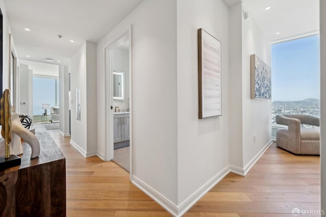 401 Harrison St Unit 45C, San Francisco, CA 94105 - hallway with light wood-style flooring, baseboards, and recessed lighting
