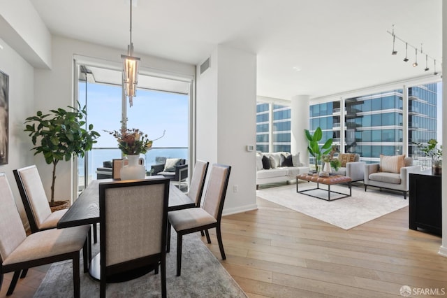 401 Harrison St Unit 45C, San Francisco, CA 94105 - dining area featuring light wood finished floors and plenty of natural light
