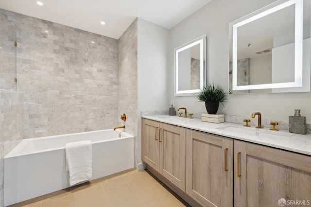 401 Harrison St Unit 45C, San Francisco, CA 94105 - bathroom with double vanity, a tub to relax in, tile patterned flooring, recessed lighting, and a shower